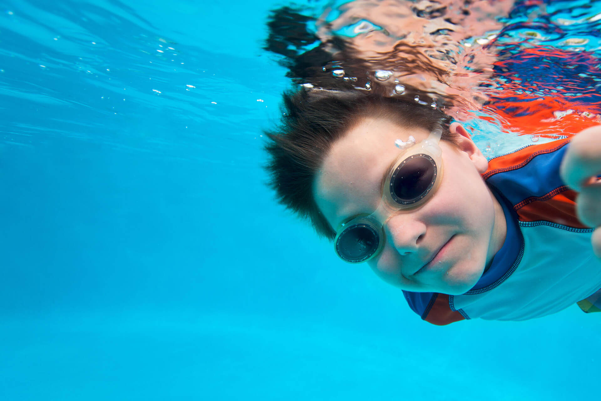 Boy swimming underwater