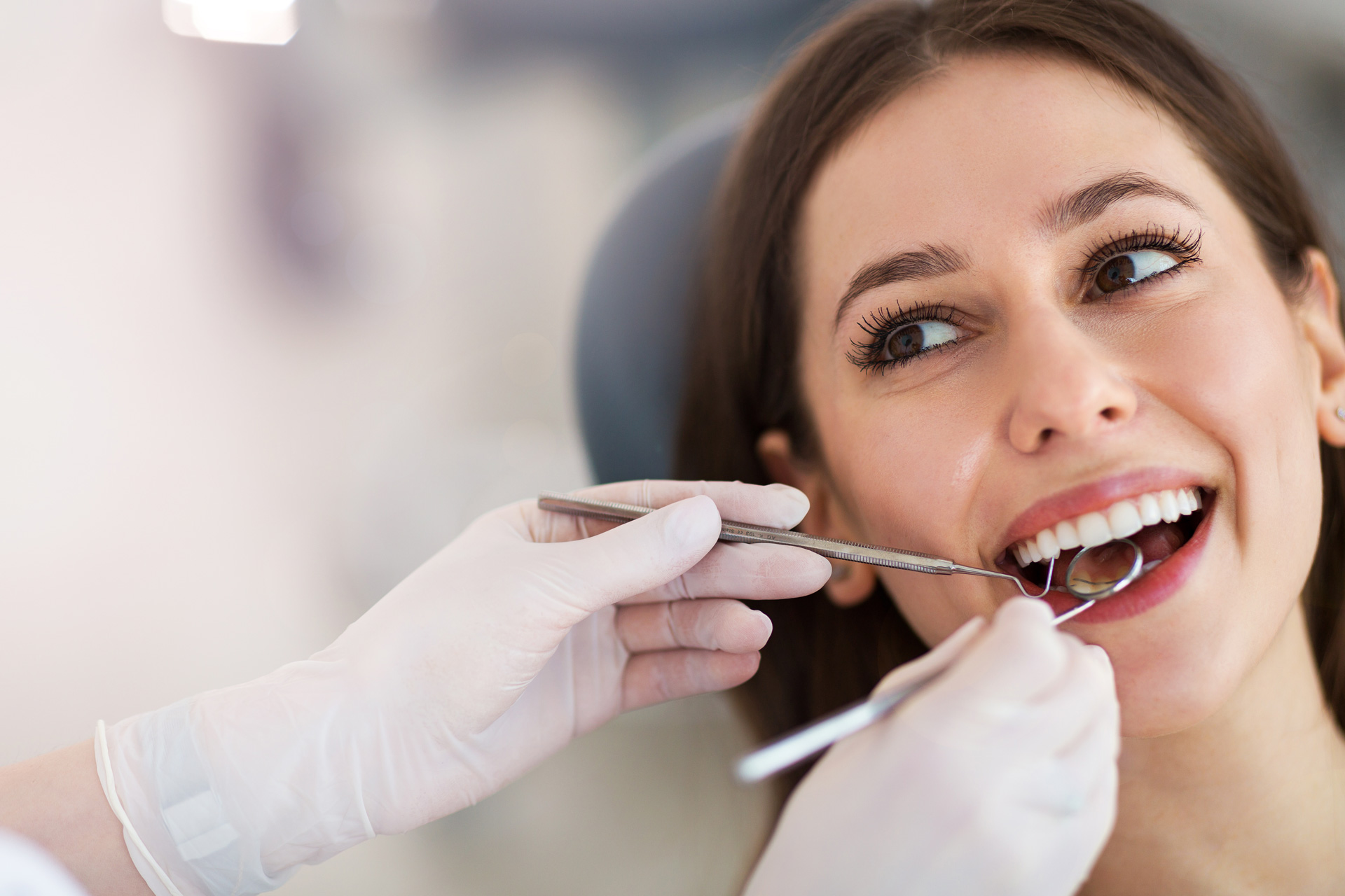 Girl getting teeth cleaned
